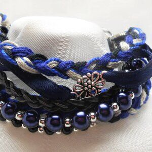 Handmade bracelet with rows of threads, beads, and charms No. 185